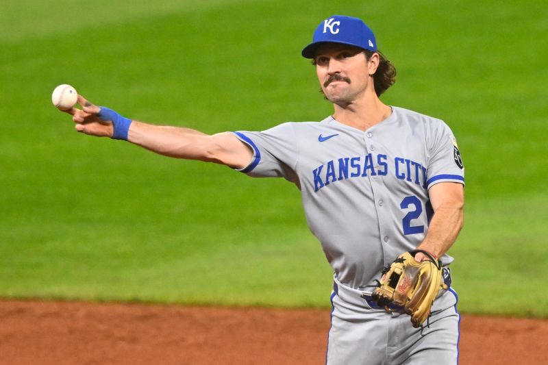 Sep 10, 2025; Cleveland, Ohio, USA; Kansas City Royals second baseman Adam Frazier (26) throws to first base in the sixth inning against the Cleveland Guardians at Progressive Field. Mandatory Credit: David Richard-Imagn Images