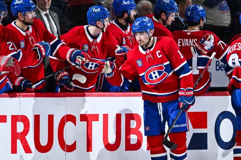 Mar 15, 2026; Montreal, Quebec, CAN; Montreal Canadiens center Nick Suzuki (14) celebrates with his teammates at the bench his goal against the Anaheim Ducks during the second period at Bell Centre. Mandatory Credit: David Kirouac-Imagn Images