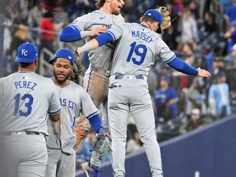 Apr 30, 2024; Toronto, Ontario, CAN;   Kansas City Royals shortstop Bobby Witt Jr. (7) and second baseman Michael Massey (19) jump as they celebrate a win over the Toronto Blue Jays at Rogers Centre. Mandatory Credit: Dan Hamilton-USA TODAY Sports