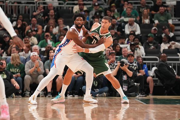 MILWAUKEE, WI - OCTOBER 26: Joel Embiid #21 of the Philadelphia 76ers looks on during the game against the Milwaukee Bucks on October 26, 2023 at the Fiserv Forum Center in Milwaukee, Wisconsin. NOTE TO USER: User expressly acknowledges and agrees that, by downloading and or using this Photograph, user is consenting to the terms and conditions of the Getty Images License Agreement. Mandatory Copyright Notice: Copyright 2023 NBAE (Photo by Jesse D. Garrabrant/NBAE via Getty Images).