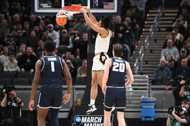 Mar 24, 2024; Indianapolis, IN, USA; Purdue Boilermakers forward Trey Kaufman-Renn (4) dunks against the Utah State Aggies during the second half at Gainbridge FieldHouse. Mandatory Credit: Robert Goddin-USA TODAY Sports