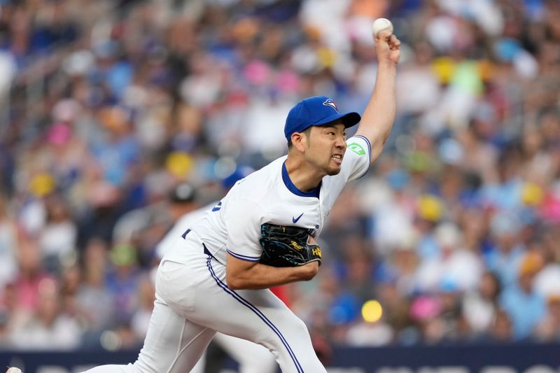 Jul 26, 2024; Toronto, Ontario, CAN; Toronto Blue Jays starting pitcher Yusei Kikuchi (16) pitches to the Texas Rangers during the first inning at Rogers Centre. Mandatory Credit: John E. Sokolowski-USA TODAY Sports