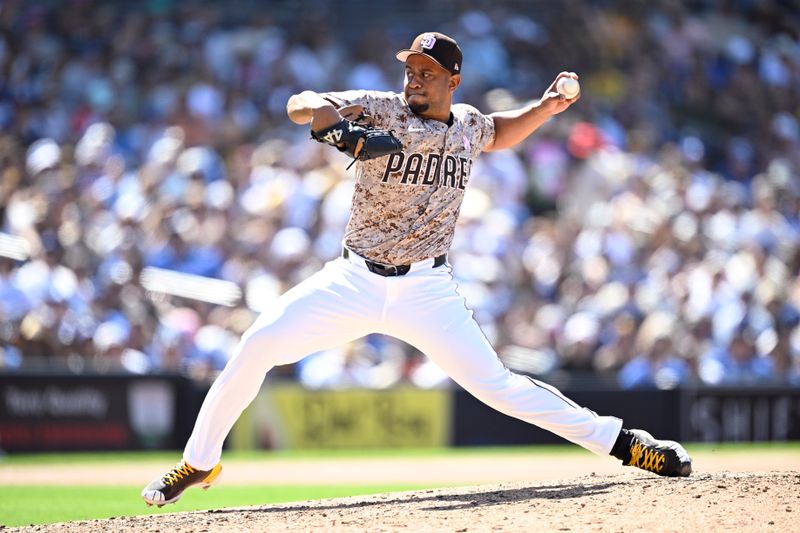 May 12, 2024; San Diego, California, USA; San Diego Padres relief pitcher Wandy Peralta (58) throws a pitch against the Los Angeles Dodgers during the eighth inning at Petco Park. Mandatory Credit: Orlando Ramirez-USA TODAY Sports