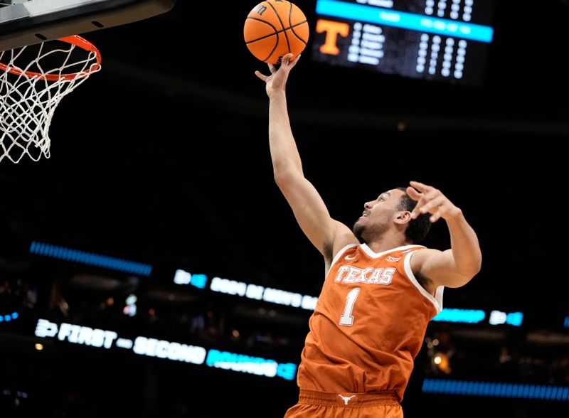 March 23, 2024, Charlotte, NC, USA;  Texas Longhorns forward Dylan Disu (1) shoots against the Tennessee Volunteers in the second round of the 2024 NCAA Tournament at the Spectrum Center. Mandatory Credit: Bob Donnan-USA TODAY Sports