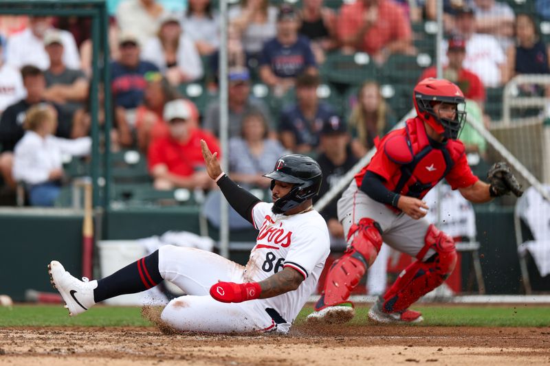 Mar 6, 2024; Fort Myers, Florida, USA;  Minnesota Twins catcher Chris Williams scores a run against the Boston Red Sox in the sixth inning at Hammond Stadium. Mandatory Credit: Nathan Ray Seebeck-USA TODAY Sports