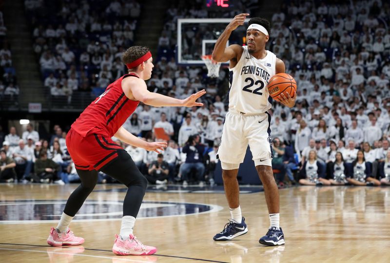 Feb 26, 2023; University Park, Pennsylvania, USA; Penn State Nittany Lions guard Jalen Pickett (22) gestures to his teammates while holding the ball as Rutgers Scarlet Knights guard Paul Mulcahy (4) defends during the first half at Bryce Jordan Center. Rutgers defeated Penn State 59-56. Mandatory Credit: Matthew OHaren-USA TODAY Sports