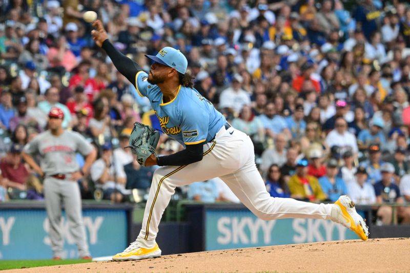 Jun 14, 2024; Milwaukee, Wisconsin, USA; Milwaukee Brewers  starting pitcher Freddy Peralta (51) pitches against the Cincinnati Reds in the first inning at American Family Field. Mandatory Credit: Benny Sieu-USA TODAY Sports