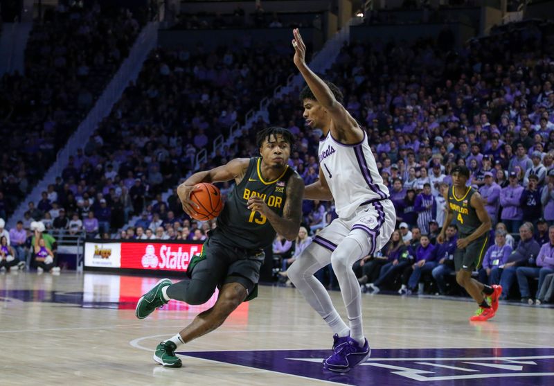 Jan 16, 2024; Manhattan, Kansas, USA; Baylor Bears guard Langston Love (13) dribbles against Kansas State Wildcats forward David N'Guessan (1) during the second half at Bramlage Coliseum. Mandatory Credit: Scott Sewell-USA TODAY Sports