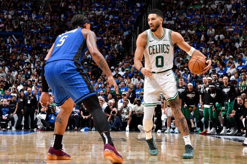 ORLANDO, FL - APRIL 27:  Jayson Tatum #0 of the Boston Celtics dribbles the ball during the game against the Orlando Magic   during Round 1 Game 4 of the 2025 NBA Playoffs on April 27, 2025 at Kia Center in Orlando, Florida. NOTE TO USER: User expressly acknowledges and agrees that, by downloading and or using this photograph, User is consenting to the terms and conditions of the Getty Images License Agreement. Mandatory Copyright Notice: Copyright 2025 NBAE (Photo by Fernando Medina/NBAE via Getty Images)