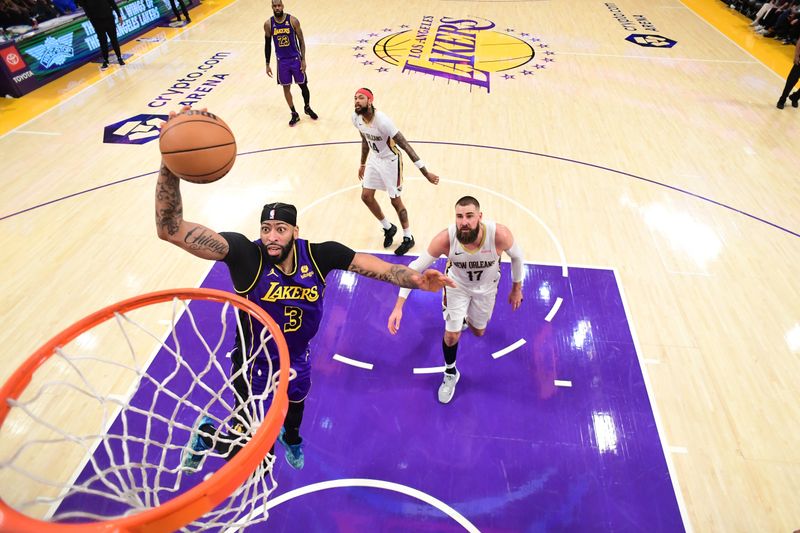 LOS ANGELES, CA - FEBRUARY 9:  Anthony Davis #3 of the Los Angeles Lakers drives to the basket during the game against the New Orleans Pelicans on February 9, 2024 at Crypto.Com Arena in Los Angeles, California. NOTE TO USER: User expressly acknowledges and agrees that, by downloading and/or using this Photograph, user is consenting to the terms and conditions of the Getty Images License Agreement. Mandatory Copyright Notice: Copyright 2024 NBAE (Photo by Adam Pantozzi/NBAE via Getty Images)