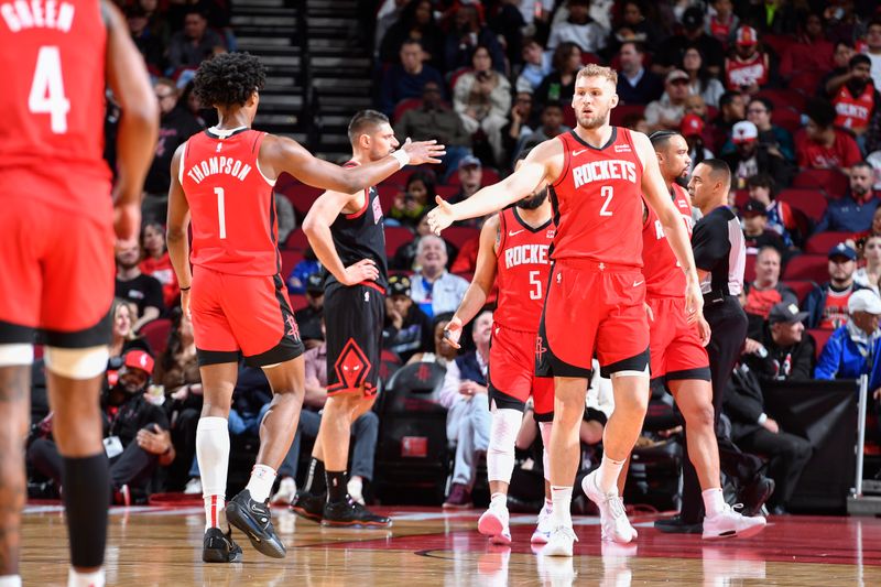 HOUSTON, TX - MARCH 21:   Amen Thompson #1 and Jock Landale #2 of the Houston Rockets react during the game against the Chicago Bulls on March 21, 2024 at the Toyota Center in Houston, Texas. NOTE TO USER: User expressly acknowledges and agrees that, by downloading and or using this photograph, User is consenting to the terms and conditions of the Getty Images License Agreement. Mandatory Copyright Notice: Copyright 2024 NBAE (Photo by Logan Riely/NBAE via Getty Images)