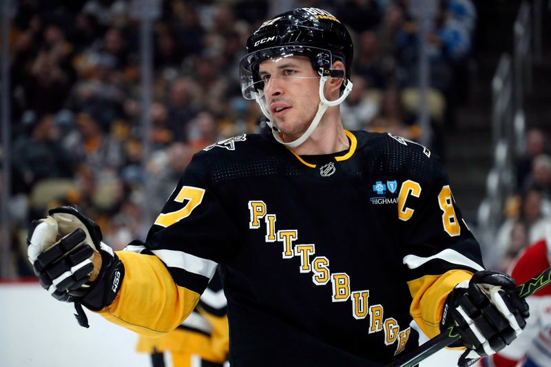 Feb 22, 2024; Pittsburgh, Pennsylvania, USA; Pittsburgh Penguins center Sidney Crosby (87) reacts on the ice against the Montreal Canadiens during the third period at PPG Paints Arena. The Penguins won 4-1. Mandatory Credit: Charles LeClaire-USA TODAY Sports