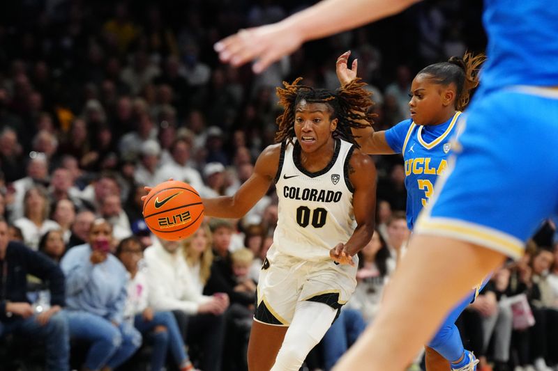 Jan 19, 2024; Boulder, Colorado, USA; Colorado Buffaloes guard Jaylyn Sherrod (00 controls the ball past UCLA Bruins guard Londynn Jones (3) in the second half at the CU Events Center. Mandatory Credit: Ron Chenoy-USA TODAY Sports
\v11