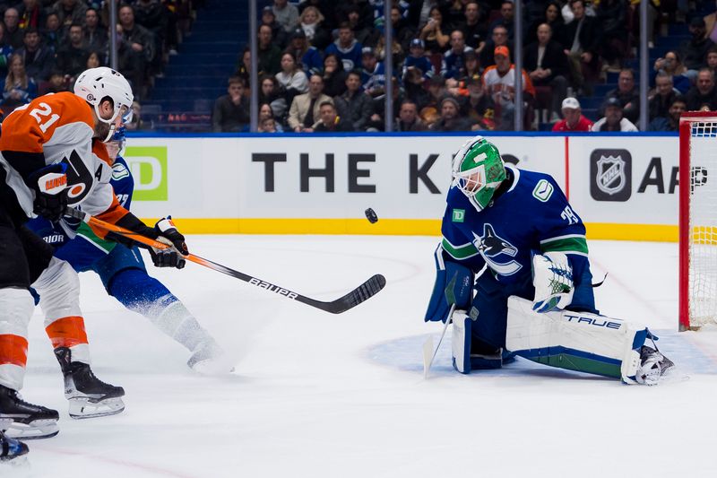 Dec 28, 2023; Vancouver, British Columbia, CAN; Vancouver Canucks goalie Casey DeSmith (29) makes a save on Philadelphia Flyers forward Scott Laughton (21) in the first period at Rogers Arena. Mandatory Credit: Bob Frid-USA TODAY Sports