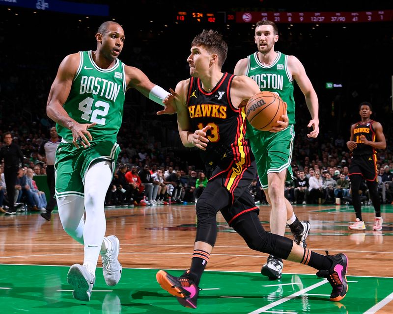 BOSTON, MA - FEBRUARY 7: Bogdan Bogdanovic #13 of the Atlanta Hawks drives to the basket during the game against the Boston Celtics on February 7, 2024 at the TD Garden in Boston, Massachusetts. NOTE TO USER: User expressly acknowledges and agrees that, by downloading and or using this photograph, User is consenting to the terms and conditions of the Getty Images License Agreement. Mandatory Copyright Notice: Copyright 2024 NBAE  (Photo by Brian Babineau/NBAE via Getty Images)