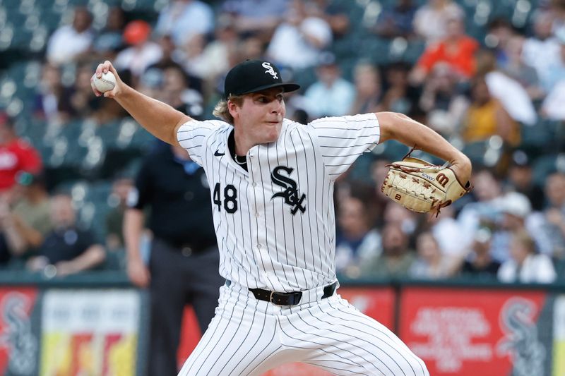 Jun 18, 2024; Chicago, Illinois, USA; Chicago White Sox starting pitcher Jonathan Cannon (48) delivers a pitch against the Houston Astros during the first inning at Guaranteed Rate Field. Mandatory Credit: Kamil Krzaczynski-USA TODAY Sports