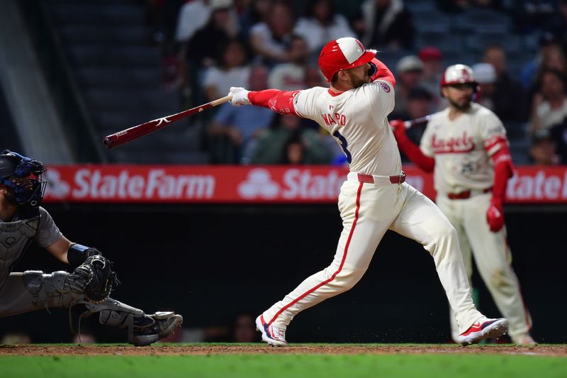 May 27, 2025; Anaheim, California, USA; Los Angeles Angels designated hitter Taylor Ward (3) hits a single against the New York Yankees during the ninth inning at Angel Stadium. Mandatory Credit: Gary A. Vasquez-Imagn Images