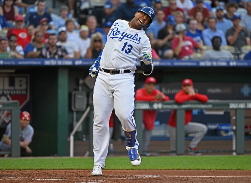 Jun 14, 2023; Kansas City, Missouri, USA;  Kansas City Royals designated hitter Salvador Perez (13) reacts after getting hit with a pitch in the third inning against the Cincinnati Reds]at Kauffman Stadium. Mandatory Credit: Peter Aiken-USA TODAY Sports