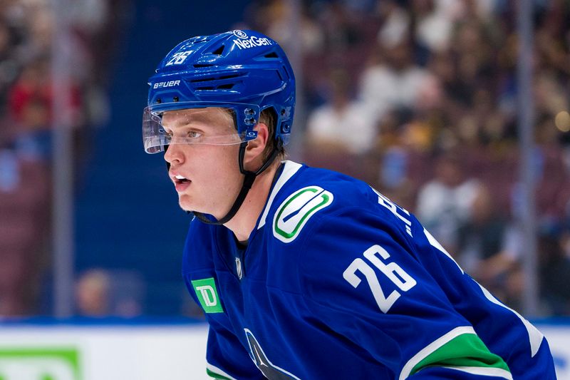 Sep 24, 2024; Vancouver, British Columbia, CAN; Vancouver Canucks defenseman Elias Pettersson (26) during a stop in play against the Seattle Kraken during the second period at Rogers Arena. Mandatory Credit: Bob Frid-Imagn Images