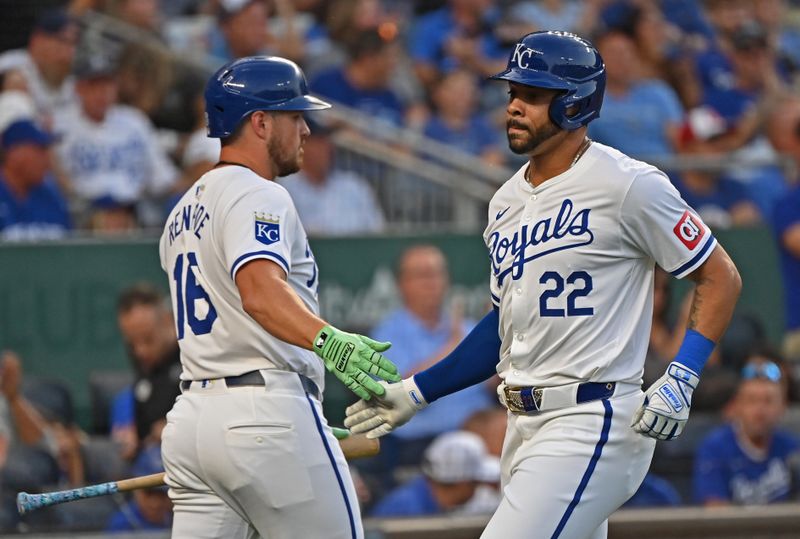 Sep 18, 2024; Kansas City, Missouri, USA;  Kansas City Royals left fielder Tommy Pham (22) shakes hands with Kansas City Royals right fielder Hunter Renfroe (16) after scoring a run in the first inning against the Detroit Tigers at Kauffman Stadium. Mandatory Credit: Peter Aiken-Imagn Images