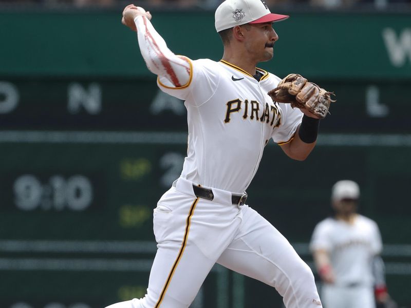 Jul 4, 2024; Pittsburgh, Pennsylvania, USA; Pittsburgh Pirates second baseman Nick Gonzales (39) throws to first base to complete a double play against the St. Louis Cardinals during the fifth inning at PNC Park. Mandatory Credit: Charles LeClaire-USA TODAY Sports