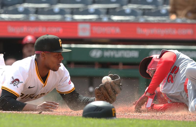 Apr 9, 2025; Pittsburgh, Pennsylvania, USA;  Pittsburgh Pirates third baseman Ke'Bryan Hayes (13) tags St. Louis Cardinals second baseman Thomas Saggese (25) out at home plate attempting to score during the eighth inning  at PNC Park. Mandatory Credit: Charles LeClaire-Imagn Images