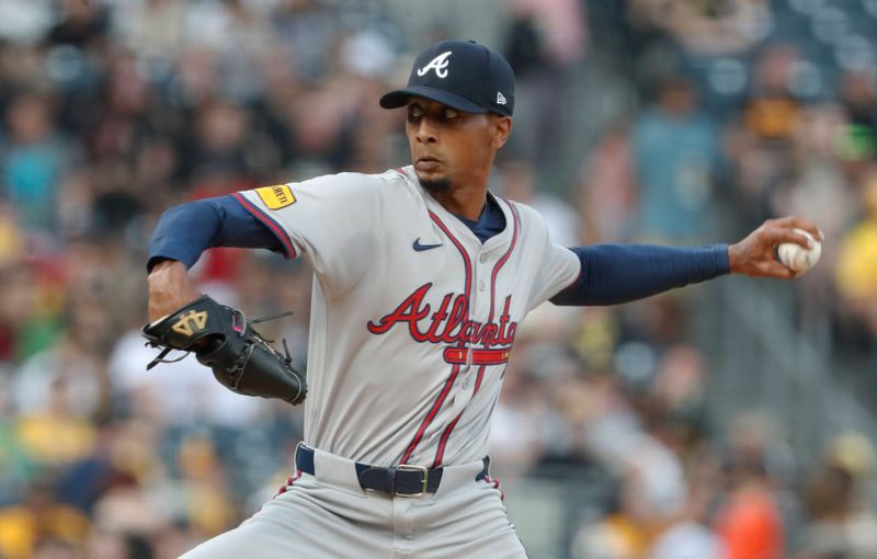 May 24, 2024; Pittsburgh, Pennsylvania, USA;  Atlanta Braves starting pitcher Ray Kerr (58) delivers a pitch against the Pittsburgh Pirates during the first inning at PNC Park. Mandatory Credit: Charles LeClaire-USA TODAY Sports