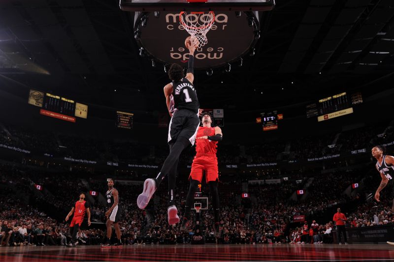 PORTLAND, OR - DECEMBER 13: Victor Wembanyama #1 of the San Antonio Spurs blocks shots during the game against the Portland Trail Blazers on December 13, 2024 at the Moda Center Arena in Portland, Oregon. NOTE TO USER: User expressly acknowledges and agrees that, by downloading and or using this photograph, user is consenting to the terms and conditions of the Getty Images License Agreement. Mandatory Copyright Notice: Copyright 2024 NBAE (Photo by Cameron Browne/NBAE via Getty Images)