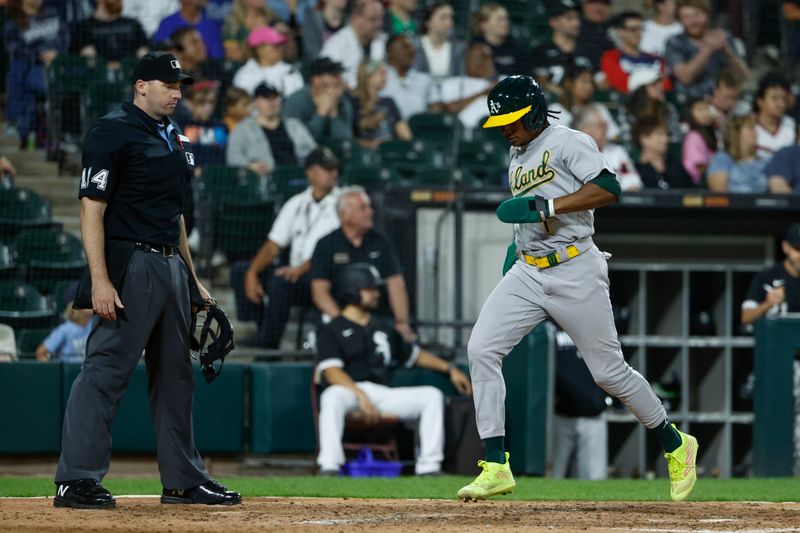 Aug 26, 2023; Chicago, Illinois, USA; Oakland Athletics center fielder Esteury Ruiz (1) scores against the Chicago White Sox during the eight inning at Guaranteed Rate Field. Mandatory Credit: Kamil Krzaczynski-USA TODAY Sports