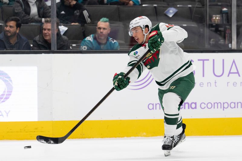 Nov 7, 2024; San Jose, California, USA;  Minnesota Wild defenseman Jared Spurgeon (46) shoots the puck during the first period against the San Jose Sharks at SAP Center at San Jose. Mandatory Credit: Stan Szeto-Imagn Images