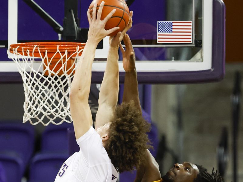 Jan 14, 2023; Seattle, Washington, USA; California Golden Bears forward Sam Alajiki (24) defends against a dunk attempt by Washington Huskies center Braxton Meah (34) during the first half at Alaska Airlines Arena at Hec Edmundson Pavilion. Mandatory Credit: Joe Nicholson-USA TODAY Sports