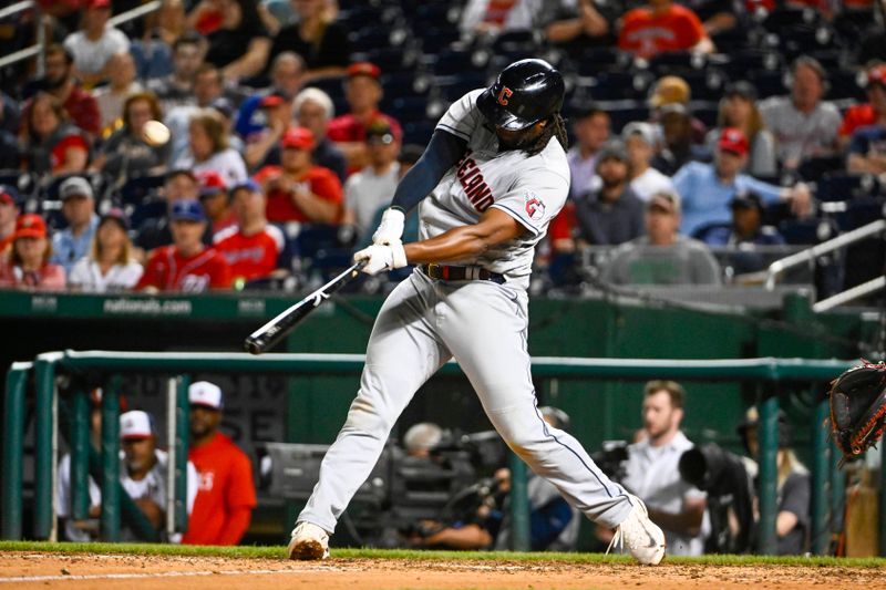 Apr 15, 2023; Washington, District of Columbia, USA; Cleveland Guardians first baseman Josh Bell (55) hits an RBI double against the Washington Nationals during the ninth inning at Nationals Park. Mandatory Credit: Brad Mills-USA TODAY Sports