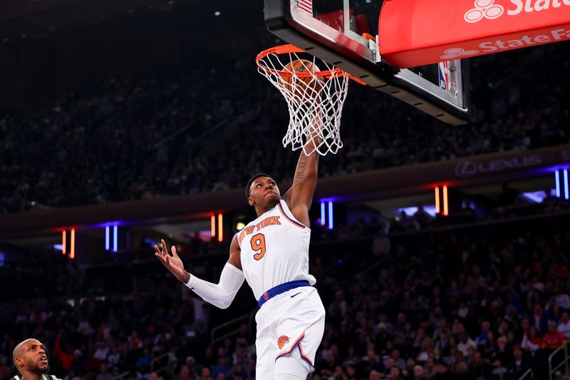 NEW YORK, NEW YORK - DECEMBER 25:  RJ Barrett #9 of the New York Knicks dunks during the first quarter of the game against the Milwaukee Bucks at Madison Square Garden on December 25, 2023 in New York City.  NOTE TO USER: User expressly acknowledges and agrees that, by downloading and or using this photograph, User is consenting to the terms and conditions of the Getty Images License Agreement. (Photo by Rich Graessle/Getty Images)