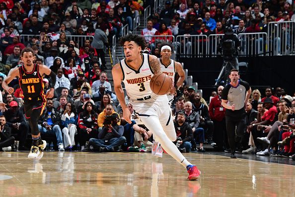 ATLANTA, GA - DECEMBER 11: Julian Strawther #3 of the Denver Nuggets dribbles the ball during the game against the Atlanta Hawks on December 11, 2023 at State Farm Arena in Atlanta, Georgia.  NOTE TO USER: User expressly acknowledges and agrees that, by downloading and/or using this Photograph, user is consenting to the terms and conditions of the Getty Images License Agreement. Mandatory Copyright Notice: Copyright 2023 NBAE (Photo by Scott Cunningham/NBAE via Getty Images)