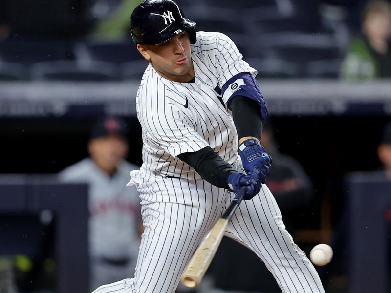 May 3, 2023; Bronx, New York, USA; New York Yankees pinch hitter Jose Trevino (39) hits a tenth inning walkoff RBI single against the Cleveland Guardians at Yankee Stadium. Mandatory Credit: Brad Penner-USA TODAY Sports