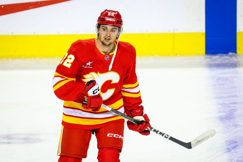 Sep 28, 2024; Calgary, Alberta, CAN; Calgary Flames left wing Jakob Pelletier (22) skates during the warmup period against the Vancouver Canucks at Scotiabank Saddledome. Mandatory Credit: Sergei Belski-Imagn Images