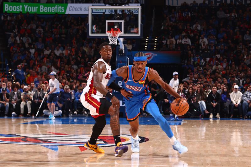 OKLAHOMA CITY, OK - MARCH 8:  Shai Gilgeous-Alexander #2 of the Oklahoma City Thunder handles the ball during the game as Terry Rozier #2 of the Miami Heat plays defense on March 8, 2024 at Paycom Arena in Oklahoma City, Oklahoma. NOTE TO USER: User expressly acknowledges and agrees that, by downloading and or using this photograph, User is consenting to the terms and conditions of the Getty Images License Agreement. Mandatory Copyright Notice: Copyright 2024 NBAE (Photo by Zach Beeker/NBAE via Getty Images)