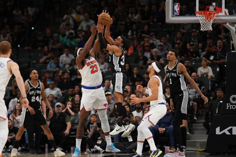 SAN ANTONIO, TX - MARCH 29:  Tre Jones #33 of the San Antonio Spurs grabs a rebound during the game against the New York Knicks on March 29, 2024 at the Frost Bank Center in San Antonio, Texas. NOTE TO USER: User expressly acknowledges and agrees that, by downloading and or using this photograph, user is consenting to the terms and conditions of the Getty Images License Agreement. Mandatory Copyright Notice: Copyright 2024 NBAE (Photos by Darren Carroll/NBAE via Getty Images)