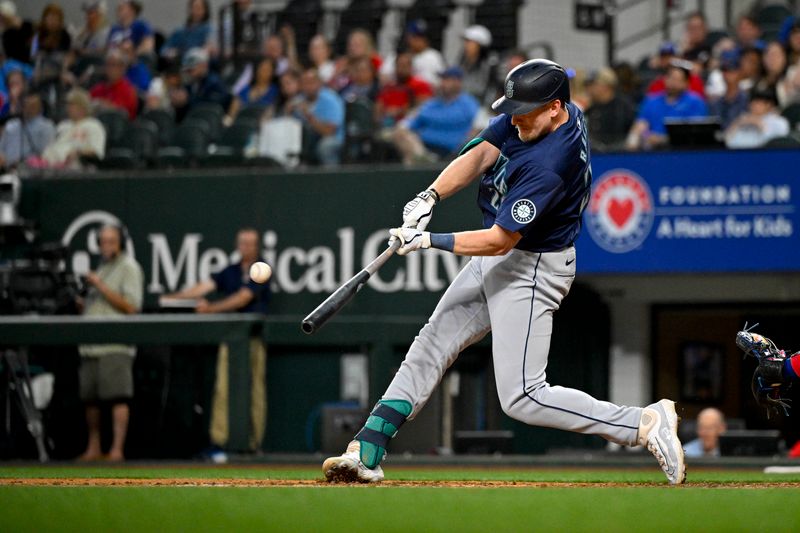 Apr 23, 2024; Arlington, Texas, USA; Seattle Mariners left fielder Luke Raley (20) bats against the Texas Rangers during the fourth inning at Globe Life Field. Mandatory Credit: Jerome Miron-USA TODAY Sports