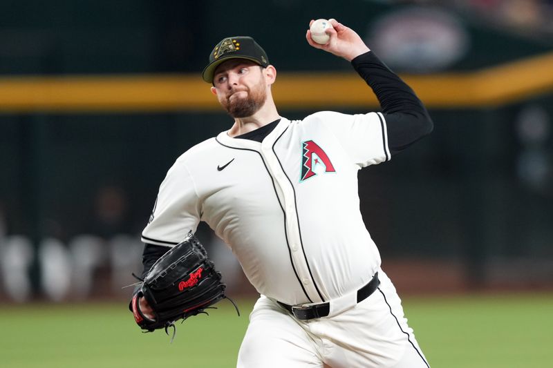 May 19, 2024; Phoenix, Arizona, USA; Arizona Diamondbacks pitcher Jordan Montgomery (52) pitches against the Detroit Tigers during the first inning at Chase Field. Mandatory Credit: Joe Camporeale-USA TODAY Sports