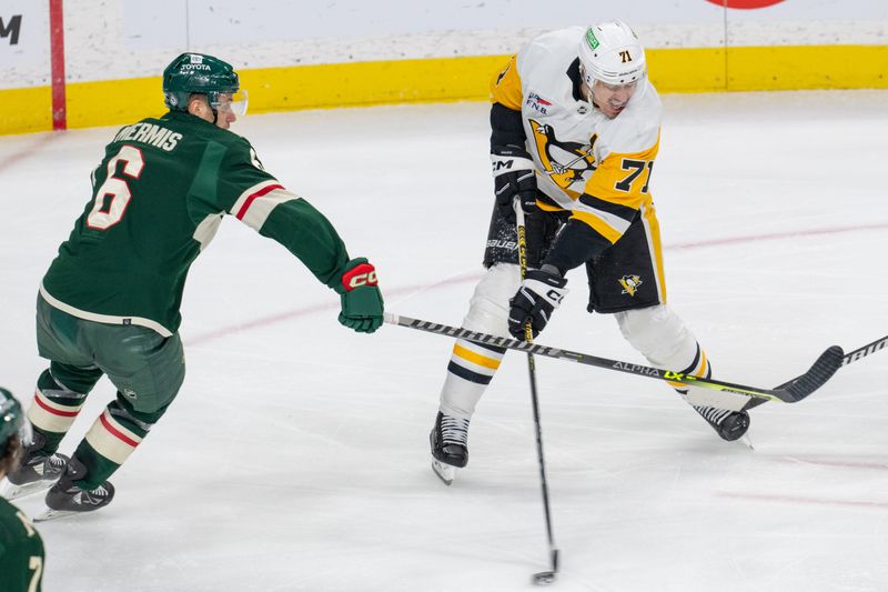 Feb 9, 2024; Saint Paul, Minnesota, USA; Pittsburgh Penguins center Evgeni Malkin (71) shoots, defended by Minnesota Wild defenseman Dakota Mermis (6) in the second period at Xcel Energy Center. Mandatory Credit: Matt Blewett-USA TODAY Sports