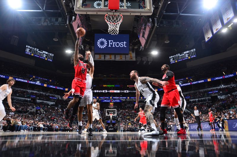 SAN ANTONIO, TX - JANUARY 13: Coby White #0 of the Chicago Bulls drives to the basket during the game against the San Antonio Spurs on January 13, 2024 at the Frost Bank Center in San Antonio, Texas. NOTE TO USER: User expressly acknowledges and agrees that, by downloading and or using this photograph, user is consenting to the terms and conditions of the Getty Images License Agreement. Mandatory Copyright Notice: Copyright 2024 NBAE (Photos by Michael Gonzales/NBAE via Getty Images)