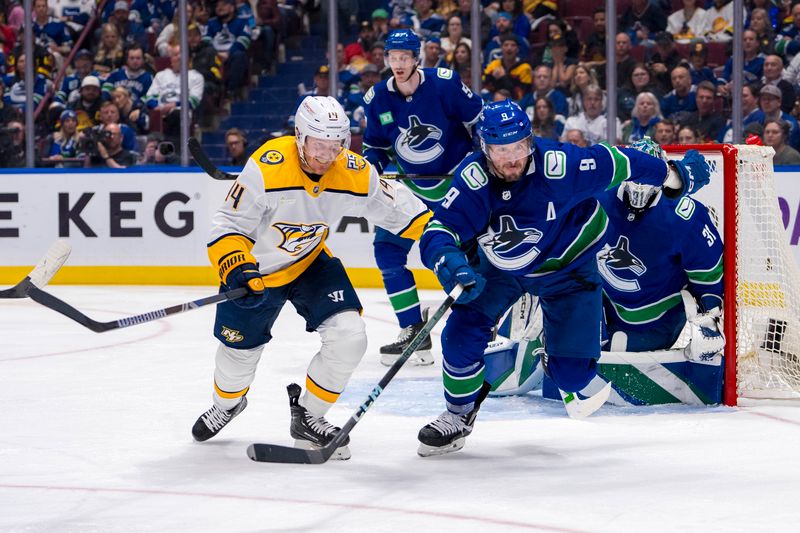 Apr 30, 2024; Vancouver, British Columbia, CAN; Nashville Predators forward Gustav Nyquist (14) and Vancouver Canucks forward J.T. Miller (9) skate after the loose puck during the second period in game five of the first round of the 2024 Stanley Cup Playoffs at Rogers Arena. Mandatory Credit: Bob Frid-USA TODAY Sports