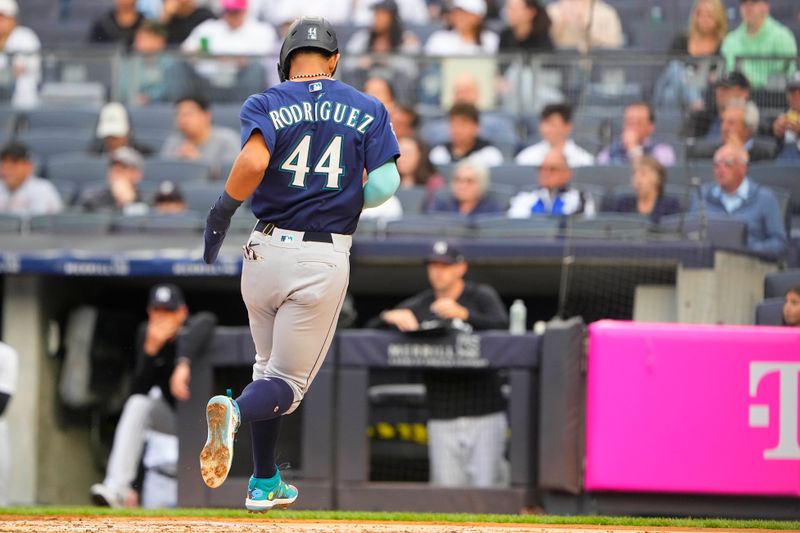 Jun 22, 2023; Bronx, New York, USA; Seattle Mariners center fielder Julio Rodriguez (44) scores a run on Seattle Mariners right fielder Teoscar Hernandez (not pictured) RBI single during the first inning at Yankee Stadium. Mandatory Credit: Gregory Fisher-USA TODAY Sports