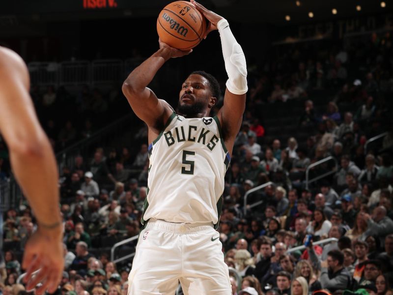 MILWAUKEE, WI - OCTOBER 20: Malik Beasley #5 of the Milwaukee Bucks shoots a three point basket during the preseason game on October 20, 2023 at the Fiserv Forum Center in Milwaukee, Wisconsin. NOTE TO USER: User expressly acknowledges and agrees that, by downloading and or using this Photograph, user is consenting to the terms and conditions of the Getty Images License Agreement. Mandatory Copyright Notice: Copyright 2023 NBAE (Photo by Gary Dineen/NBAE via Getty Images).