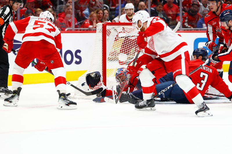 Mar 26, 2024; Washington, District of Columbia, USA; Washington Capitals goaltender Charlie Lindgren (79) allows a goal by Detroit Red Wings left wing David Perron (57) during the second period at Capital One Arena. Mandatory Credit: Amber Searls-USA TODAY Sports