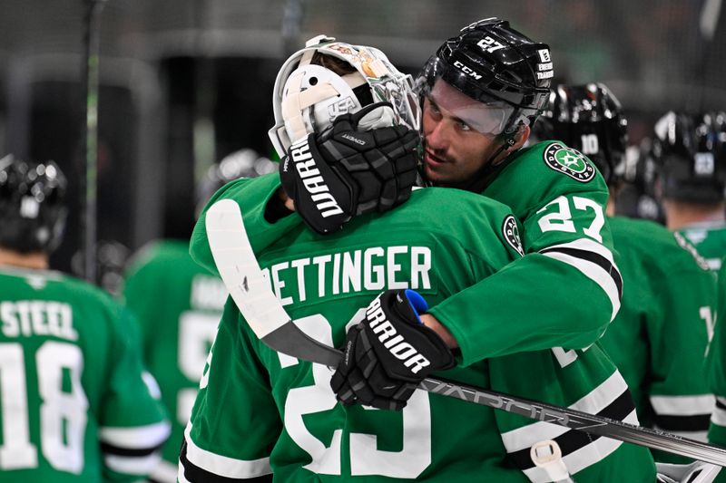 Oct 15, 2024; Dallas, Texas, USA; Dallas Stars goaltender Jake Oettinger (29) and left wing Mason Marchment (27) celebrate the Stars victory over the San Jose Sharks at the American Airlines Center. Mandatory Credit: Jerome Miron-Imagn ImagesOct 15, 2024; Dallas, Texas, USA; during the overtime shootout period at the American Airlines Center. Mandatory Credit: Jerome Miron-Imagn Images