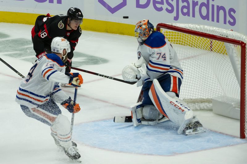 Nov 19, 2024; Ottawa, Ontario, CAN; Edmonton Oilers goalie Stuart Skinner (74) makes a save on a shot from  Ottawa Senators center Tim Stutzle (18) in the third period at the Canadian Tire Centre. Mandatory Credit: Marc DesRosiers-Imagn Images