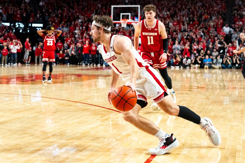 Feb 1, 2024; Lincoln, Nebraska, USA; Nebraska Cornhuskers guard Sam Hoiberg (1) gets a loose ball against the Nebraska Cornhuskers during overtime at Pinnacle Bank Arena. Mandatory Credit: Dylan Widger-USA TODAY Sports