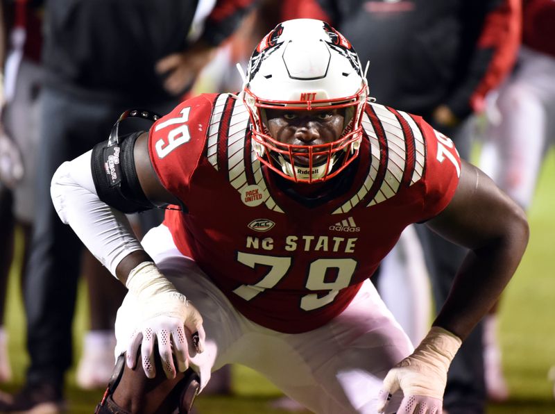 Oct 30, 2021; Raleigh, North Carolina, USA; North Carolina State Wolfpack tackle Ikem Ekwonu (79) warms up prior to a game against the Louisville Cardinals at Carter-Finley Stadium. Mandatory Credit: Rob Kinnan-USA TODAY Sports